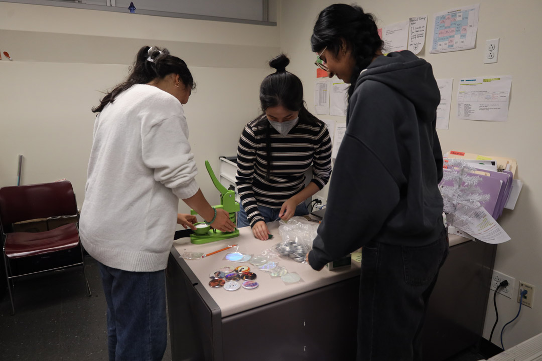 The roof of a building with a glass structure and potted plants.